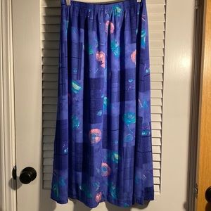 C.M. Shapes blue floral/patterned skirt. Elastic waistband. 100% Rayon.